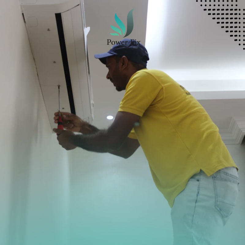 Power Fix technician repairing a home air conditioner